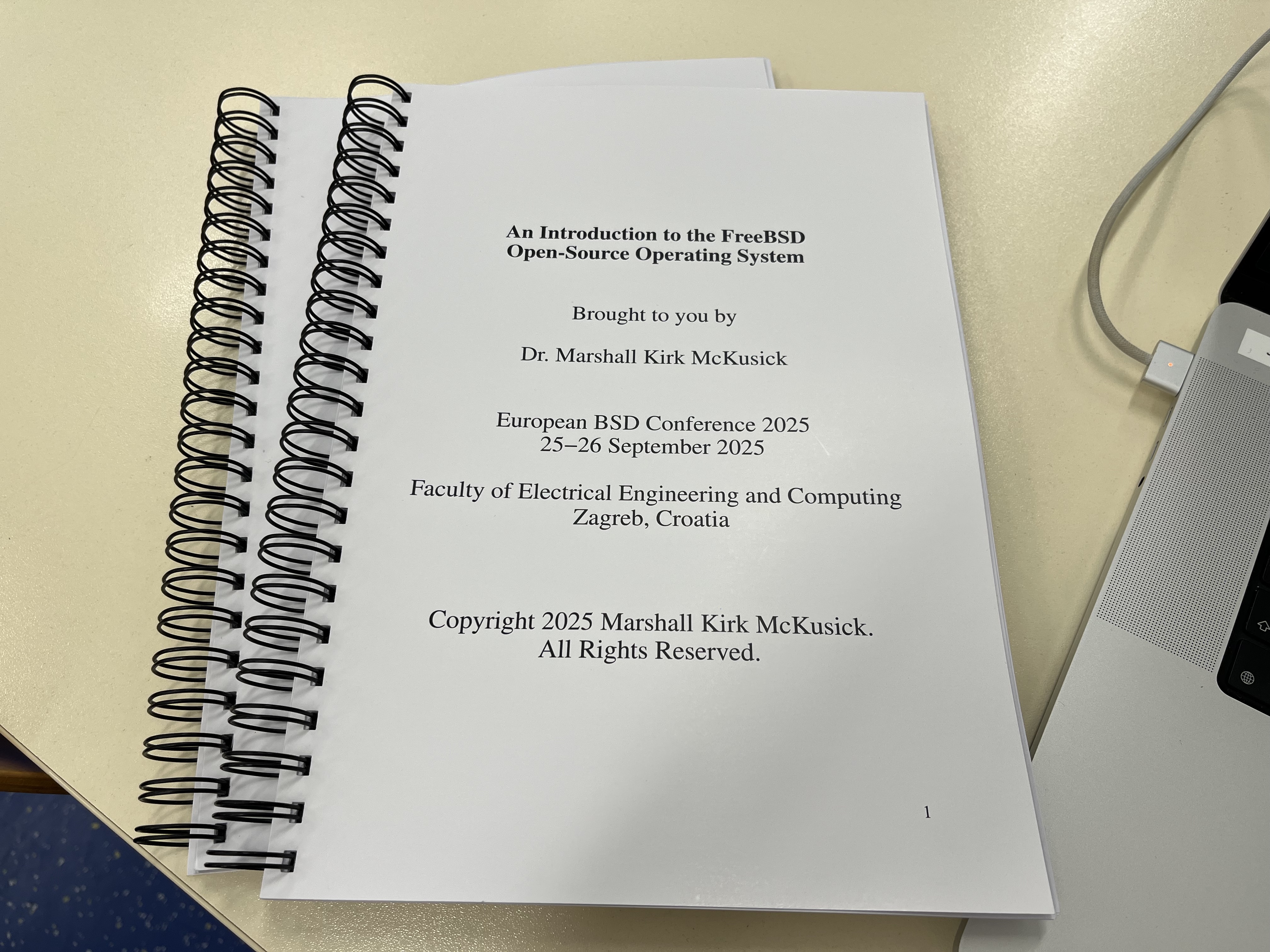 Two spiral notebooks of lecture notes, one for each day